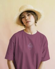 Guru Daddy Red Voilet tee on model with straw hat